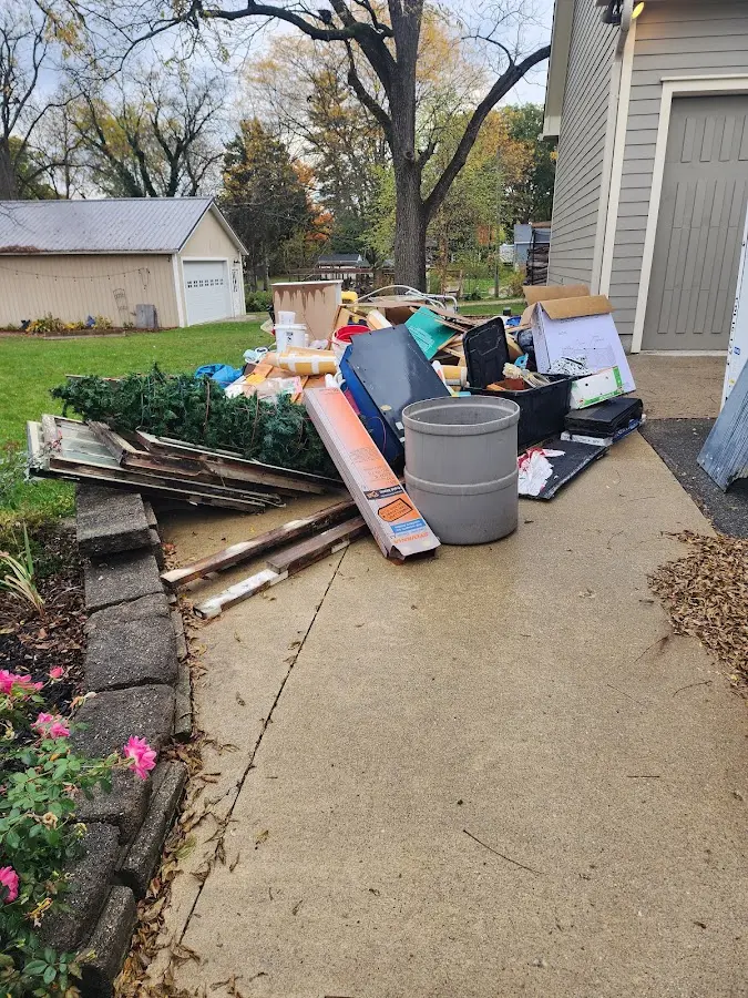 Dumpster being loaded with debris for 10 Yard Dumpster Rental in Norco